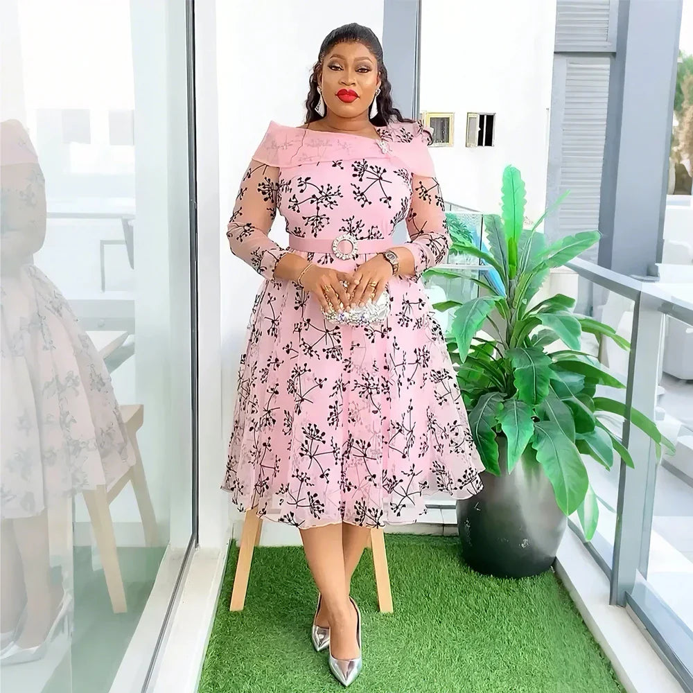 Stunning plus size maxi dress in a graceful pose, highlighting the exquisite craftsmanship and modern African design suitable for evening wear.