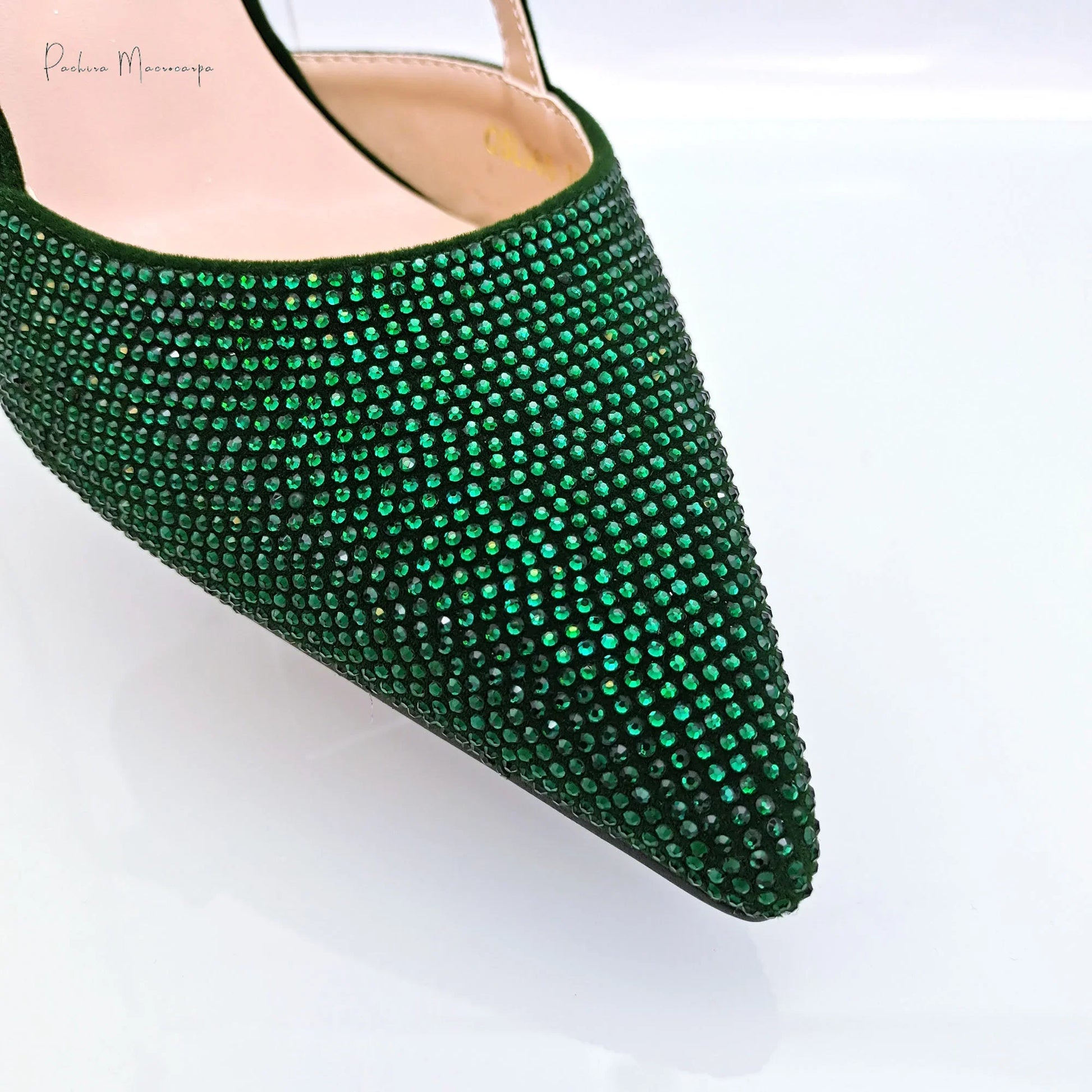 Stylish green shoulder bag designed for women, featuring pointed toe pumps in high heels, suitable for party occasions, presented in a chic setting.