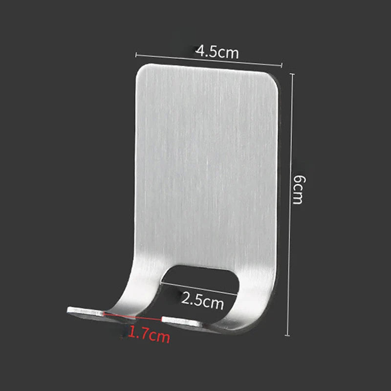 Organised display of razors in a stainless steel wall-mounted rack, highlighting a clutter-free and sophisticated bathroom interior.