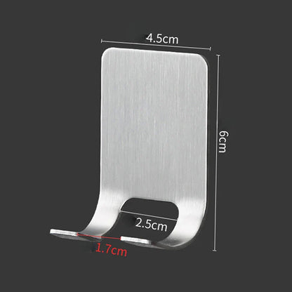 Organised display of razors in a stainless steel wall-mounted rack, highlighting a clutter-free and sophisticated bathroom interior.