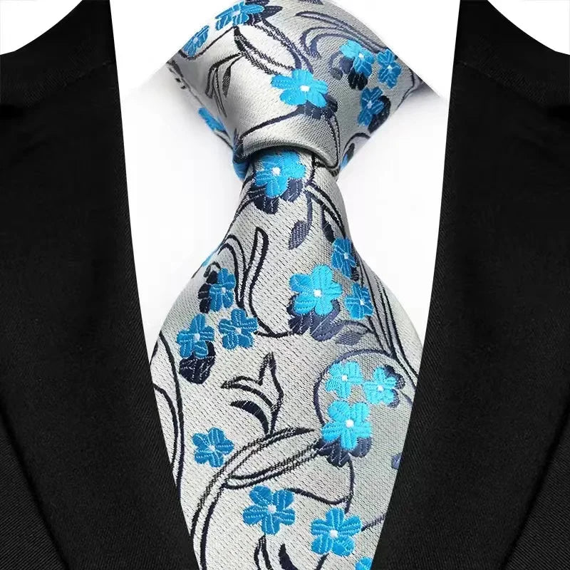 Stylish floral jacquard men's necktie featuring intricate patterns, perfect for formal occasions, available in a diverse palette of 41 colour options.