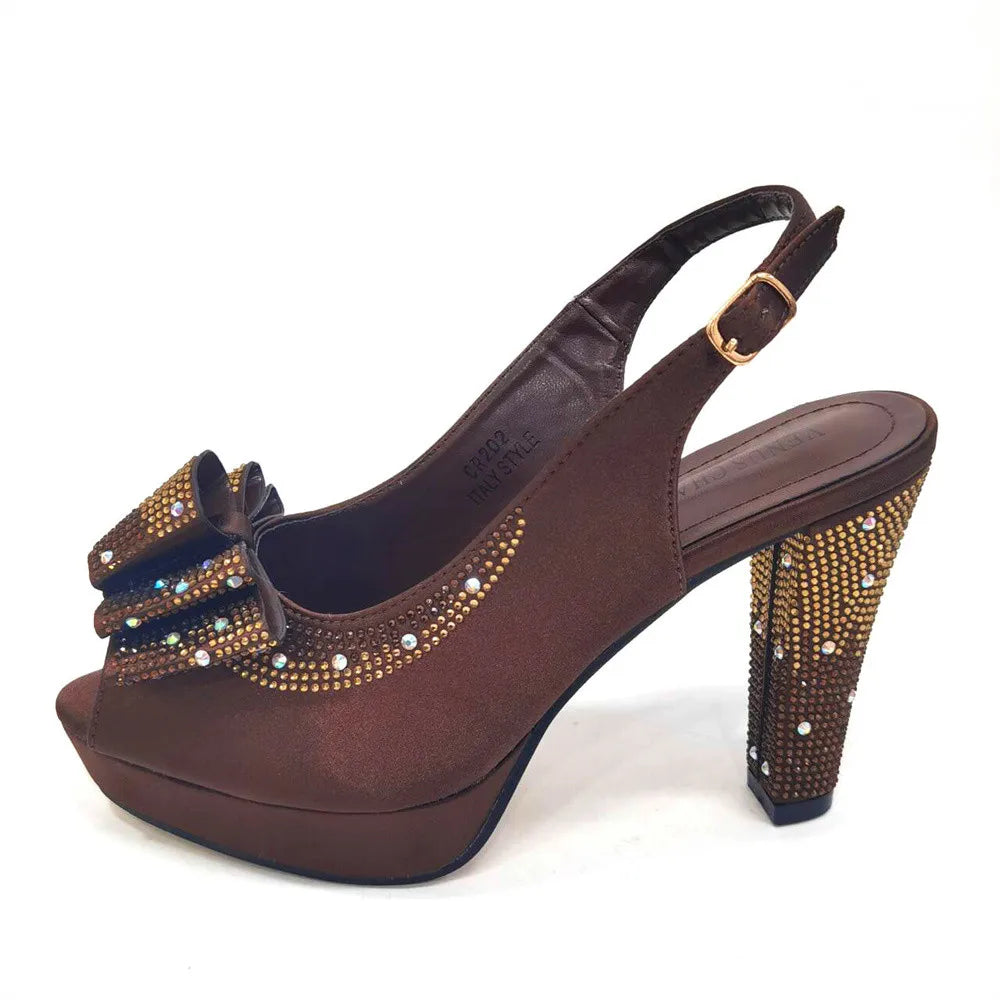 Close-up of luxurious pointed toe slingback sandals with bling detail, crafted for women's summer and autumn parties, in rich coffee colour.