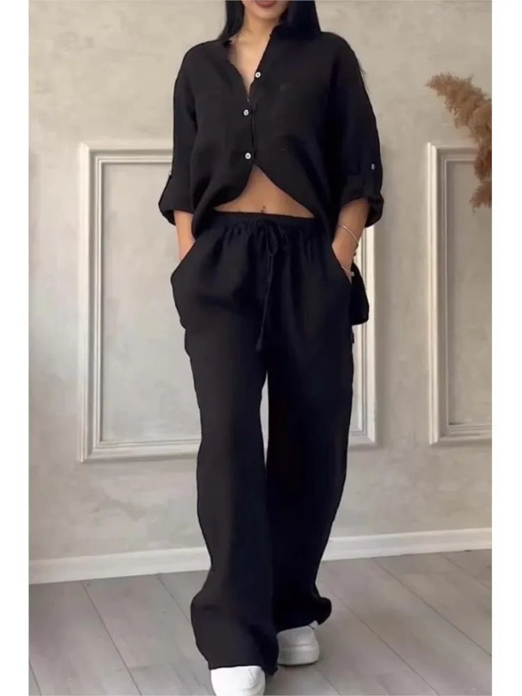 Close-up view of the luxurious fabric and design details of the women's casual two piece set, showcasing its elegant button decoration and turn-down collar.