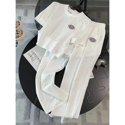 Display of the women’s leisure summer sports set on a model, exuding chic sophistication with a solid colour theme perfect for summer sports and leisure.