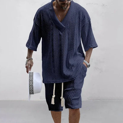 Elegant men's knitted casual summer outfit featuring a stylish V-neck t-shirt paired with drawstring shorts, designed for ultimate comfort and sophistication in solid colour with functional pockets.