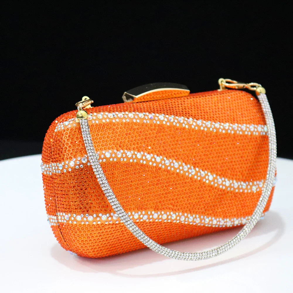 Chic matching bag set featuring a stylish black handbag with a metal handle and rhinestone detailing, designed for sophisticated women.