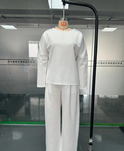 Elegant model showcasing the women's two-piece set, highlighting the flattering fit and sophisticated design of the ankle-length pants.