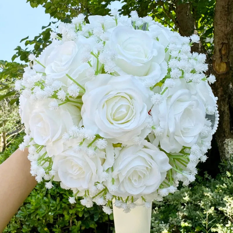 Stunning close-up of a silk wedding bouquet adorned with baby's breath roses and luxurious pearl lace detailing.