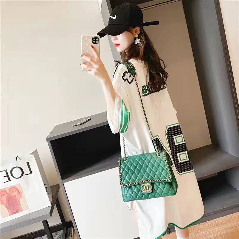 sophisticated summer oversized t-shirt for women, designed in a minimalist style with slight stretch for added comfort, a must-have addition to a luxury casual wardrobe