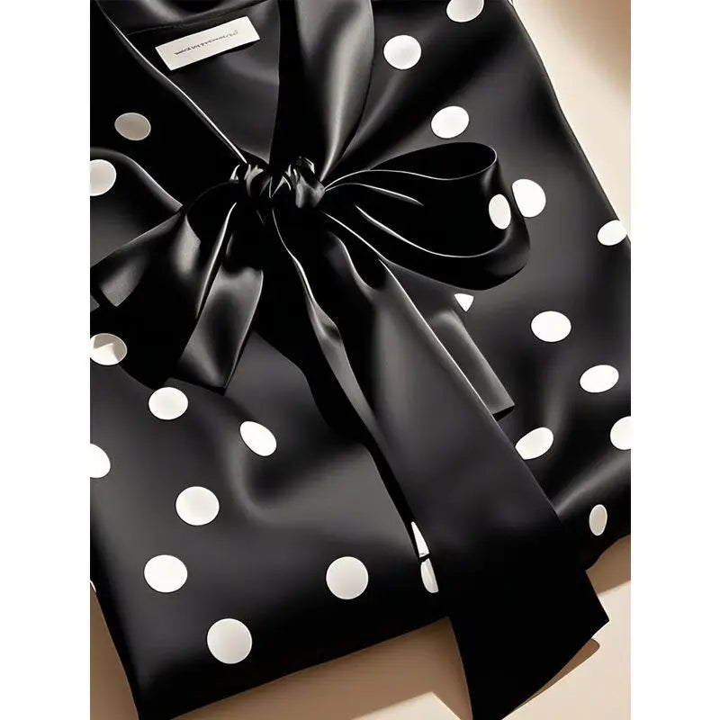 Chic long-sleeve women's blouse showcasing intricate lace-up detailing and a fashionable loose fit, perfect for elegant occasions.