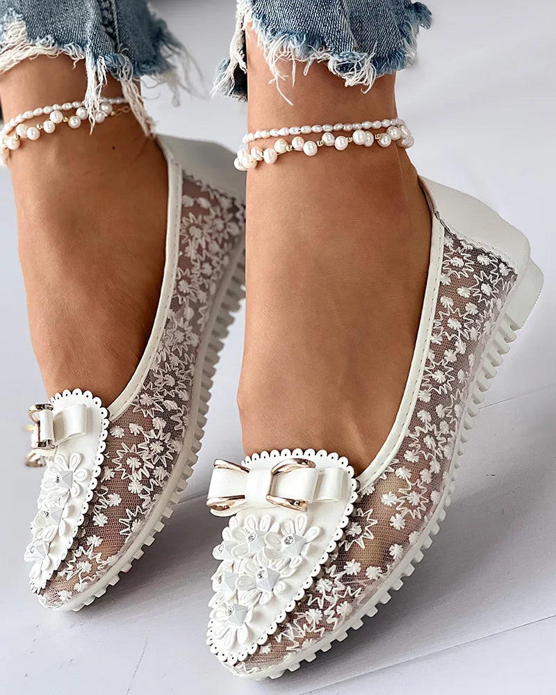 Stylish and breathable floral embroidered loafers designed for women, offering a combination of comfort and sophistication.