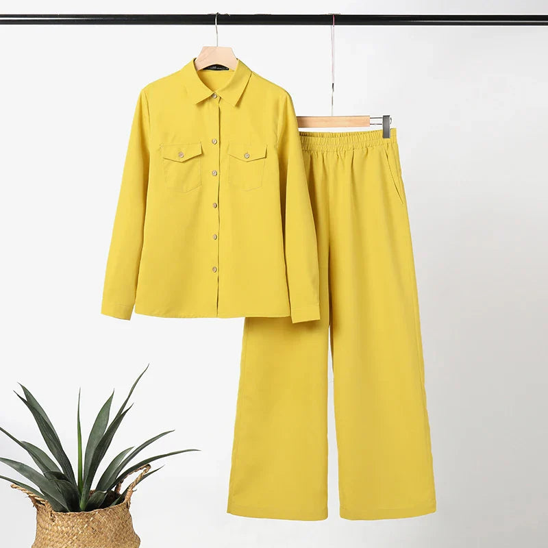 Stylish women's lapel neck shirt paired with ankle-length wide leg pants in crisp white, capturing modern elegance for streetwear and office wear.