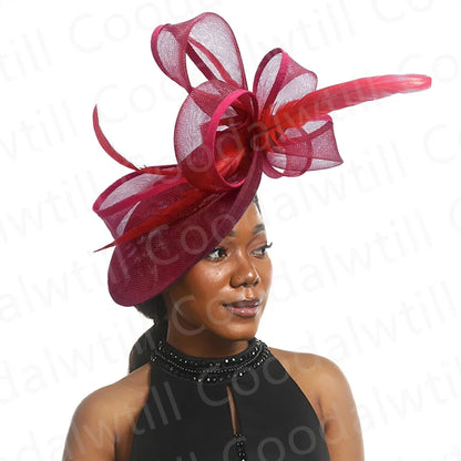 Elegant grey fascinator headpiece displayed on a soft surface, exemplifying fashion-forward style for race day and elegant gatherings.