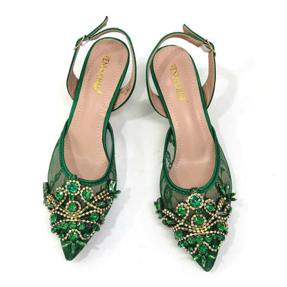 Elegant green lace low heel shoes adorned with crystal detailing, perfect for women's formal occasions.