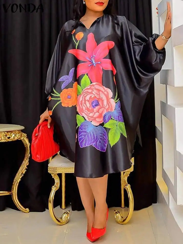 Chic and versatile VONDA Women’s Bohemian Floral Midi Dress modelled elegantly, perfect for office wear or holiday celebrations with its unique design.