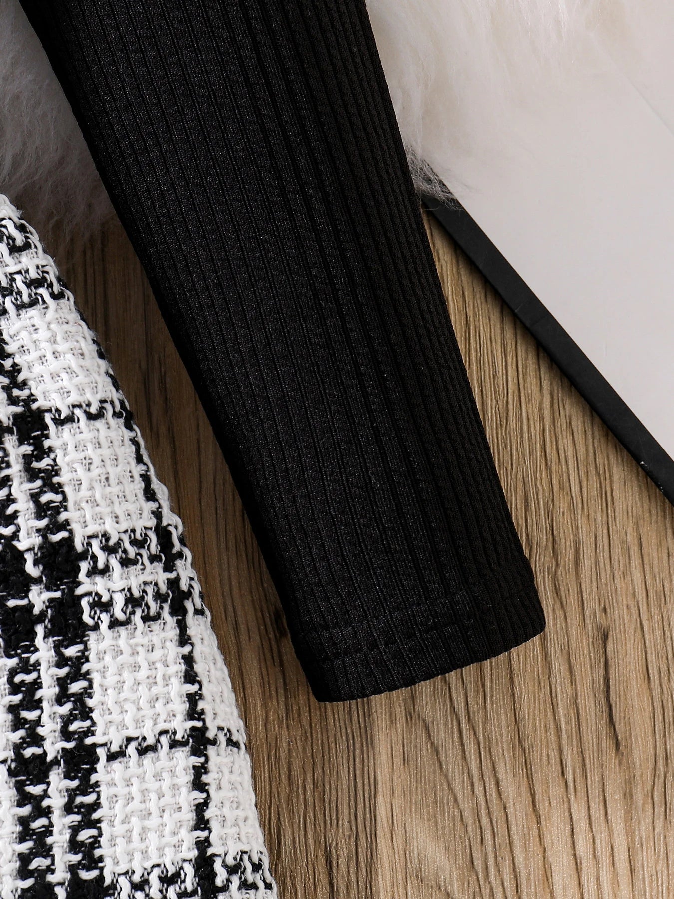 Charming autumn outfit for girls featuring a fashionable knitted top paired with a plaid skirt, perfect for creating stylish looks for ages 4-6Y.