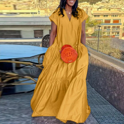 Chic floor-length plus-size maxi dress designed for women, featuring a V-neckline and a luxurious, relaxed silhouette ideal for warm summer occasions.