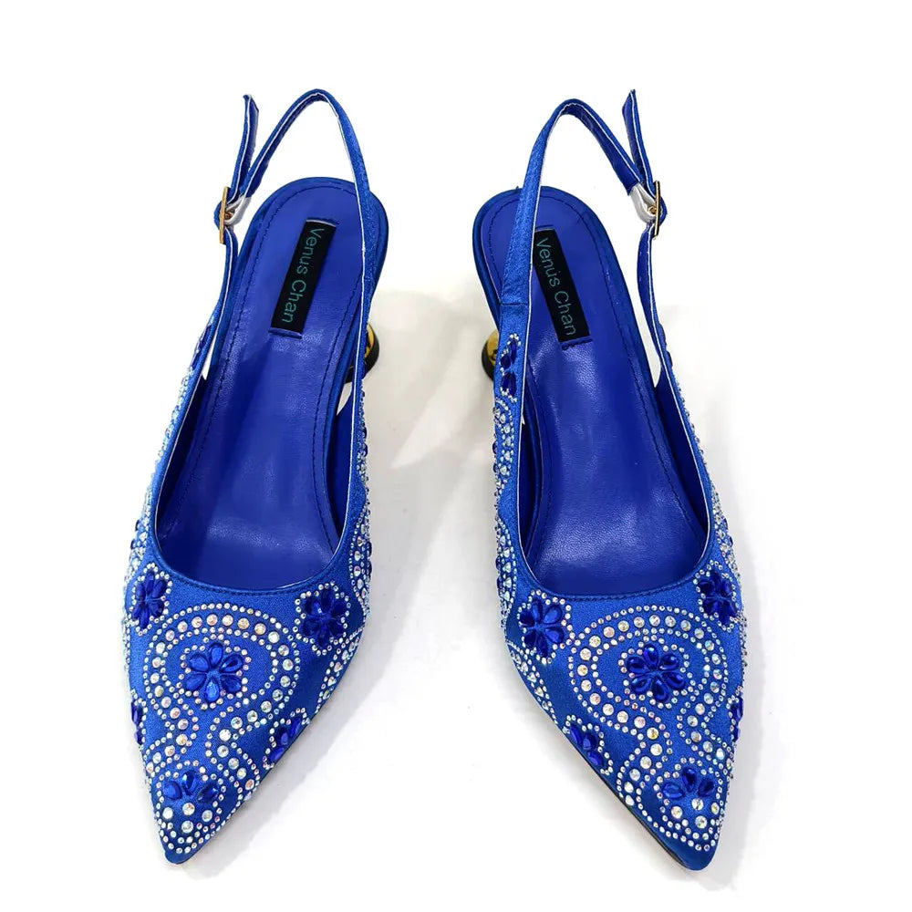 Luxurious fuchsia high heels featuring a rhinestone toe detail, perfect for women's fashion.