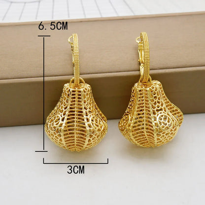 Stylish Trendy Bohemia Long Tassel Earrings displayed on a velvet surface, highlighting their luxurious geometric pattern and gold finish.