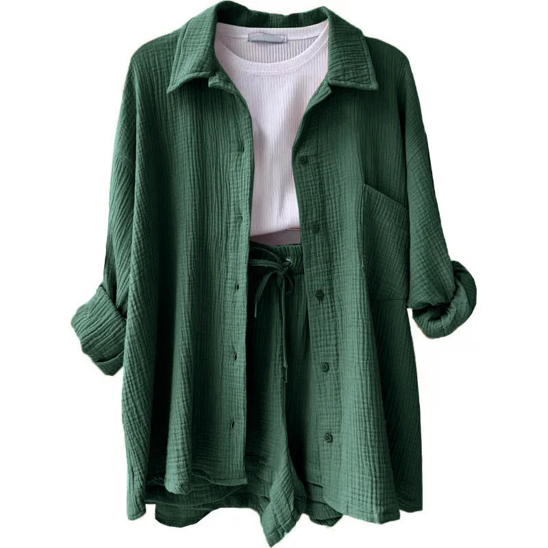 Stylish full-length view of the women's grass green 2-piece set, highlighting the relaxed fit of the cardigan blouse and shorts combined for a casual yet elegant look.