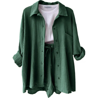 Stylish full-length view of the women's grass green 2-piece set, highlighting the relaxed fit of the cardigan blouse and shorts combined for a casual yet elegant look.
