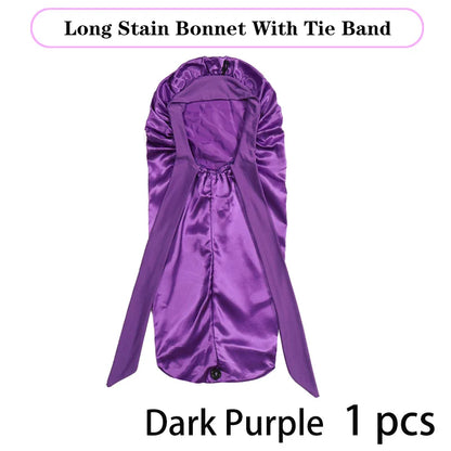 Elegant silk sleep cap designed for curly hair, featuring a secure tie for a perfect fit, available in various striking colours for a personalised touch.