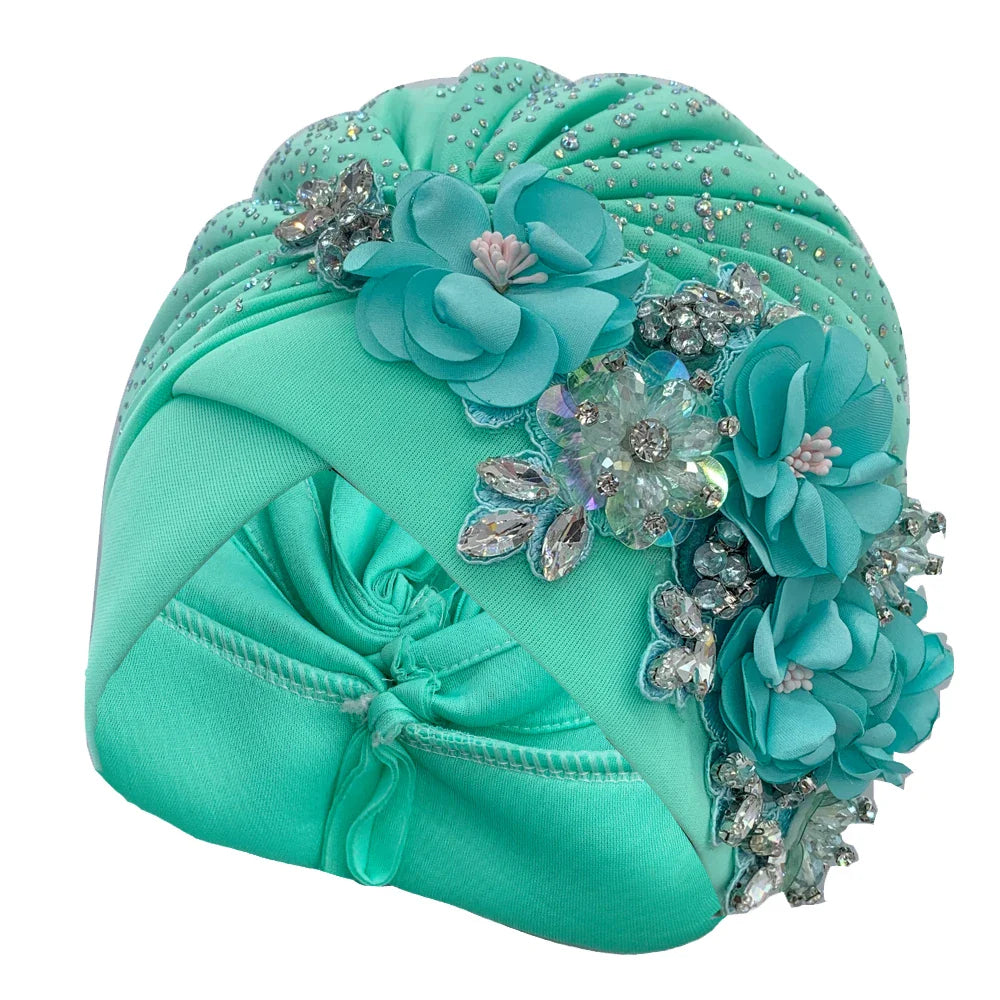 Stylish African Turban Cap adorned with shimmering rhinestones, perfect for adding a touch of sophistication to any outfit.