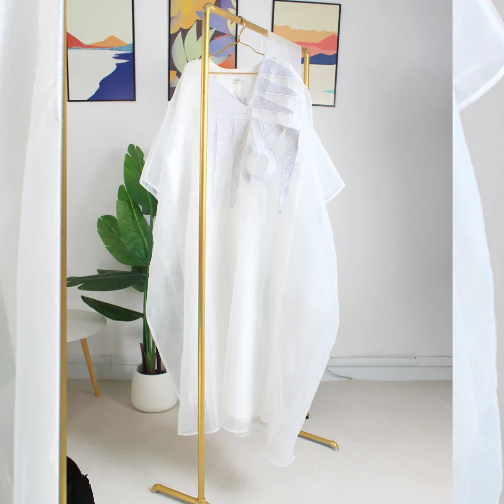 Elegant plus size white embroidered African abaya dress for women, showcasing intricate designs perfect for formal parties and church gatherings.