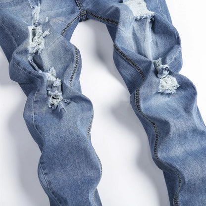 Close-up of Luxury Men's Ripped Skinny Jeans, detailing the high-quality denim and trendy design elements.