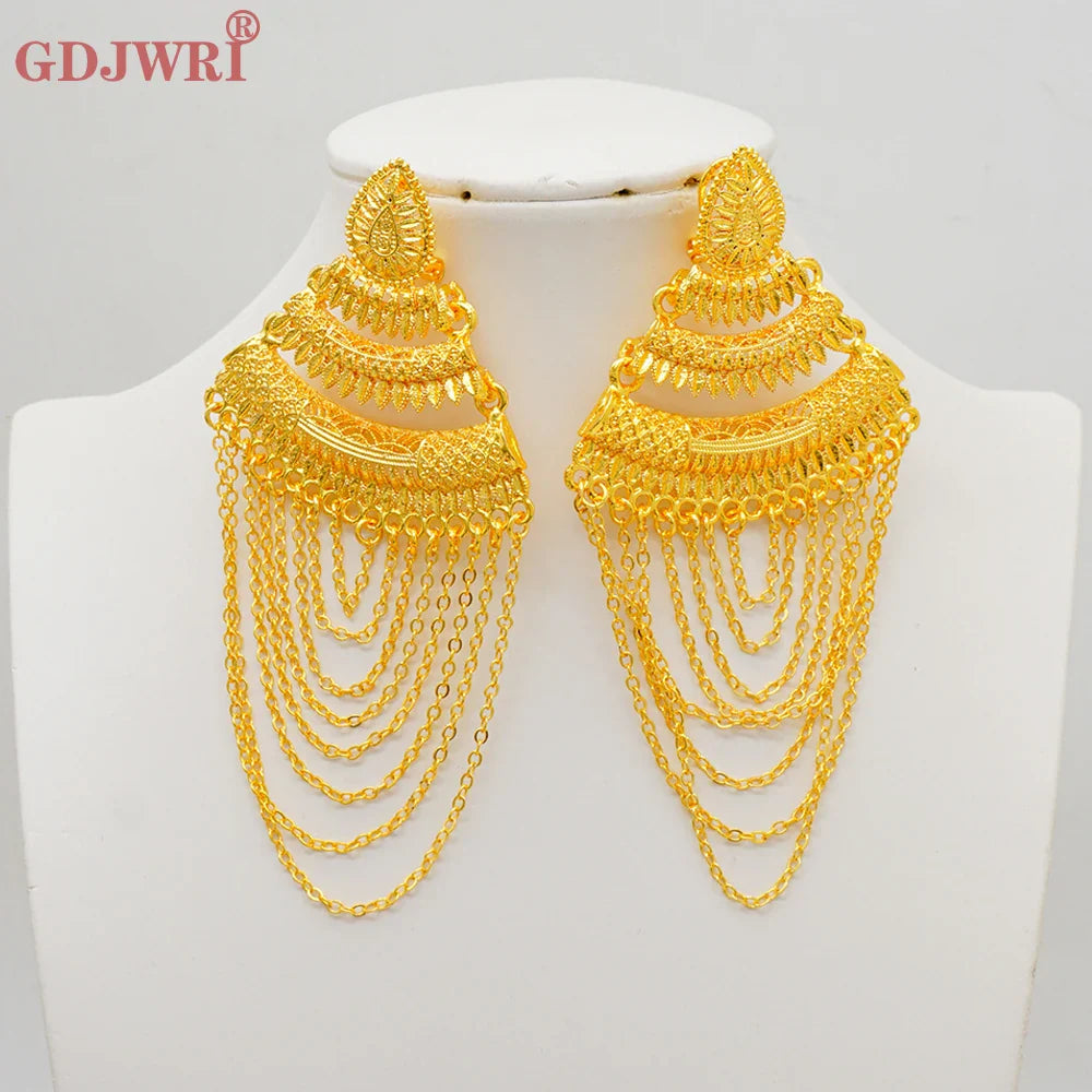 Elegant copper dangle earrings featuring a geometric design, encapsulating luxury with long tassels, perfect for weddings and parties.