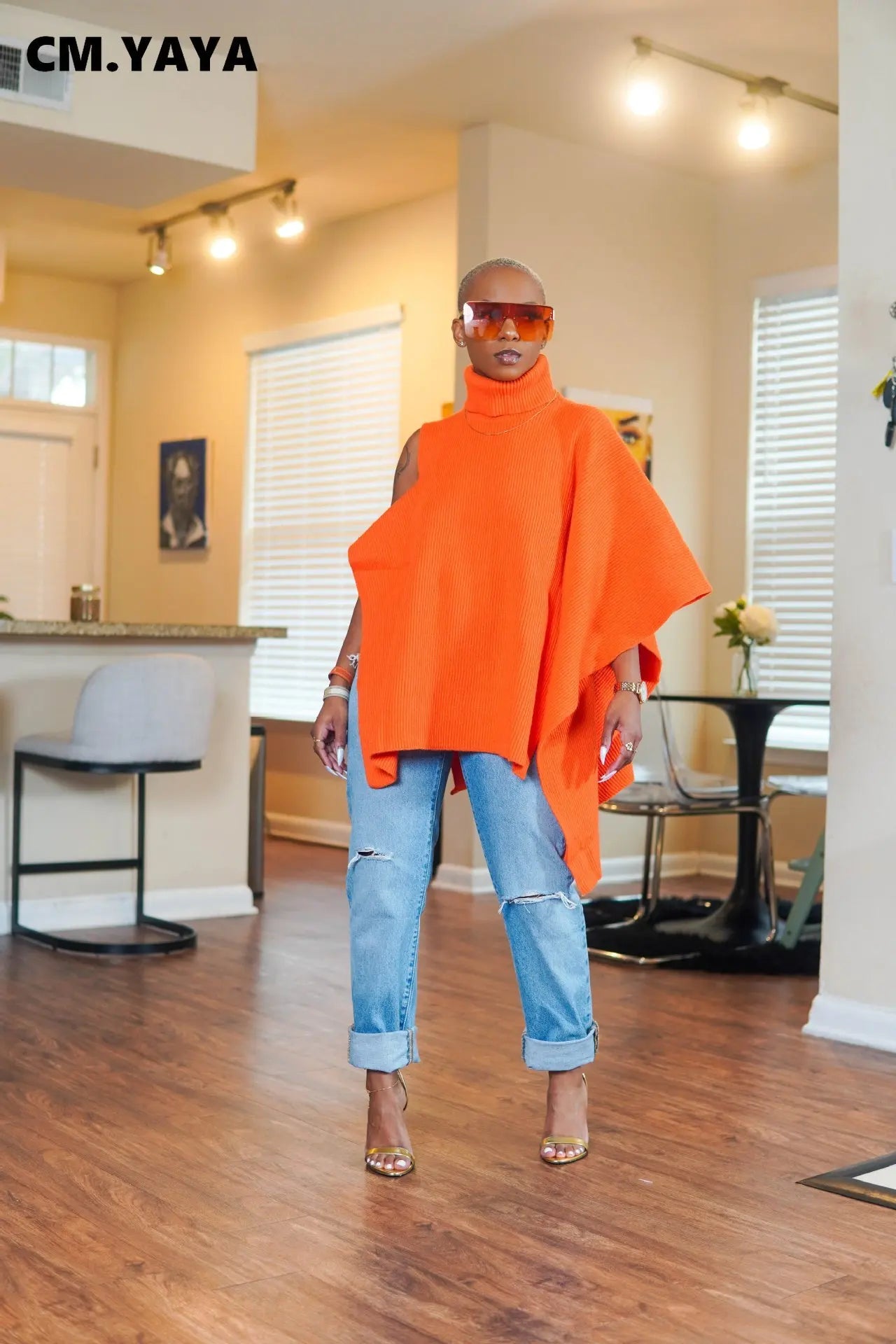 Close-up of CM.YAYA Women's elegant turtleneck sweater showcasing exquisite knit texture and stylish hollow-out details for winter fashion.