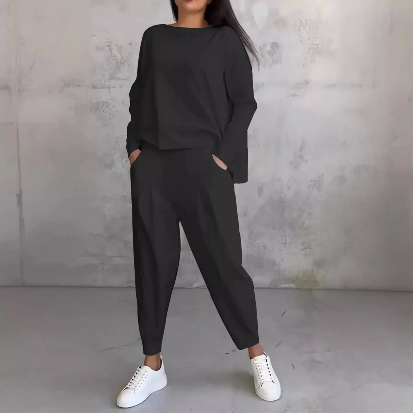 Elegant women's two-piece set featuring a solid full sleeve O-neck top paired with stylish midi waist long pants, designed with functional pockets for a luxurious yet casual look, perfect for autumn and winter fashion.