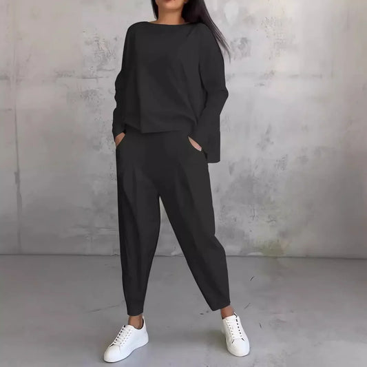 Elegant women's two-piece set featuring a solid full sleeve O-neck top paired with stylish midi waist long pants, designed with functional pockets for a luxurious yet casual look, perfect for autumn and winter fashion.
