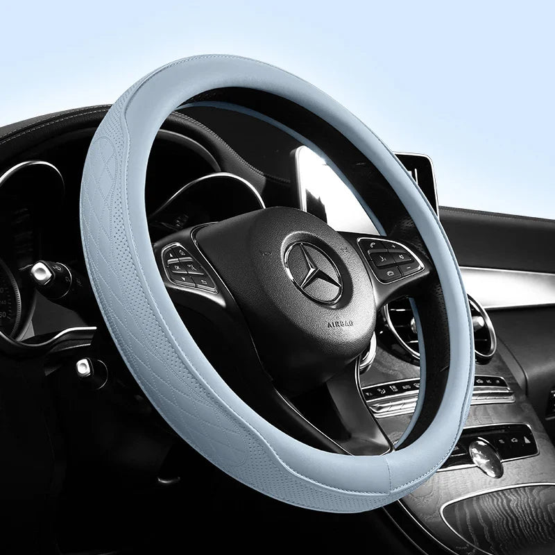 Elegant universal 15-inch steering wheel cover, made of breathable Napa leather with a stylish perforated patchwork design, ideal for enhancing vehicle aesthetics.
