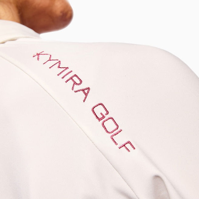 KYMIRA luxury women's infrared golf polo shirt in action on the golf course, illustrating its performance and comfort during gameplay.