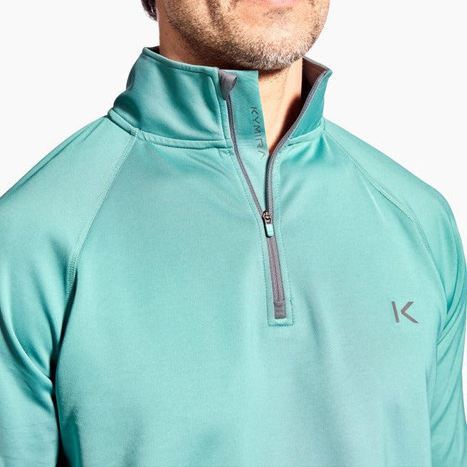 Men's Kymira Infrared 1/4 Zip Top artfully arranged, showcasing the premium quality and advanced fabric technology for elevating performance.