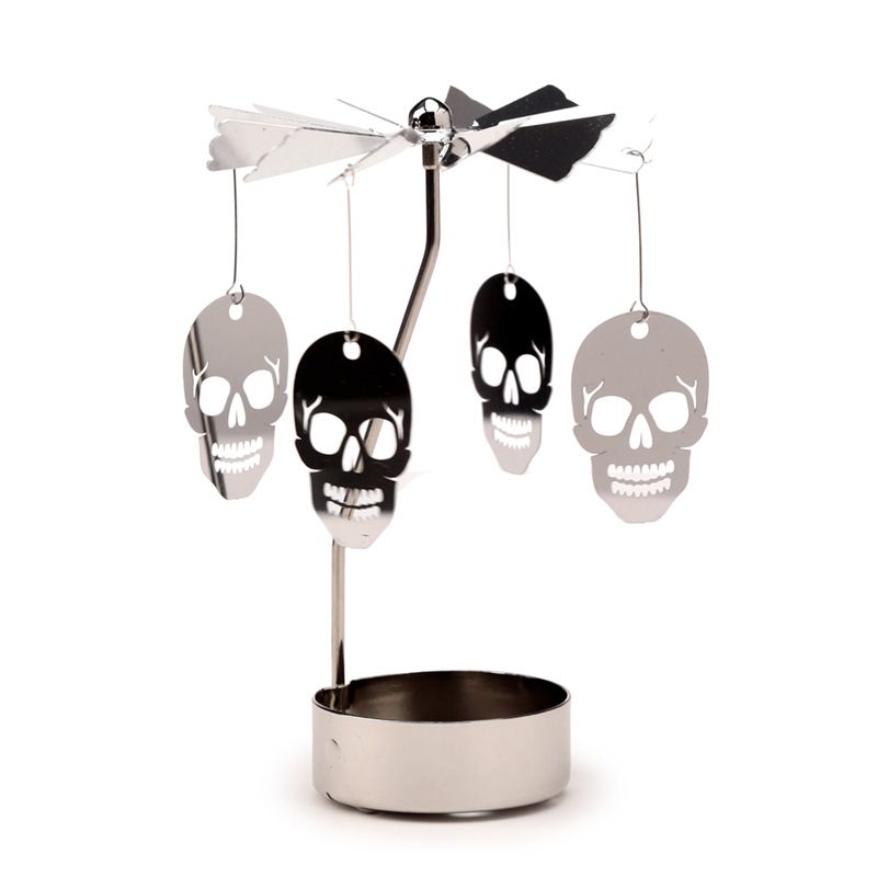 Elegant Gothic Spinning Skulls Tea Light Candle Holder in metal design, 12cm height, casting mesmerizing shadows.