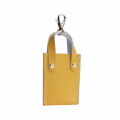 Stylish leather mini tote bag charm in rich ochre yellow, designed by Zatchels, perfect for enhancing handbags or keys.