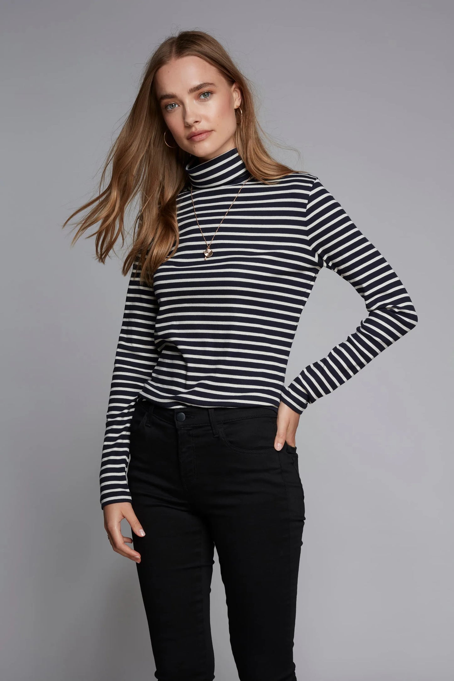 Luxury Women's Striped Long Sleeve Cotton Roll Neck Top in elegant stripes, perfect for sophisticated layering.