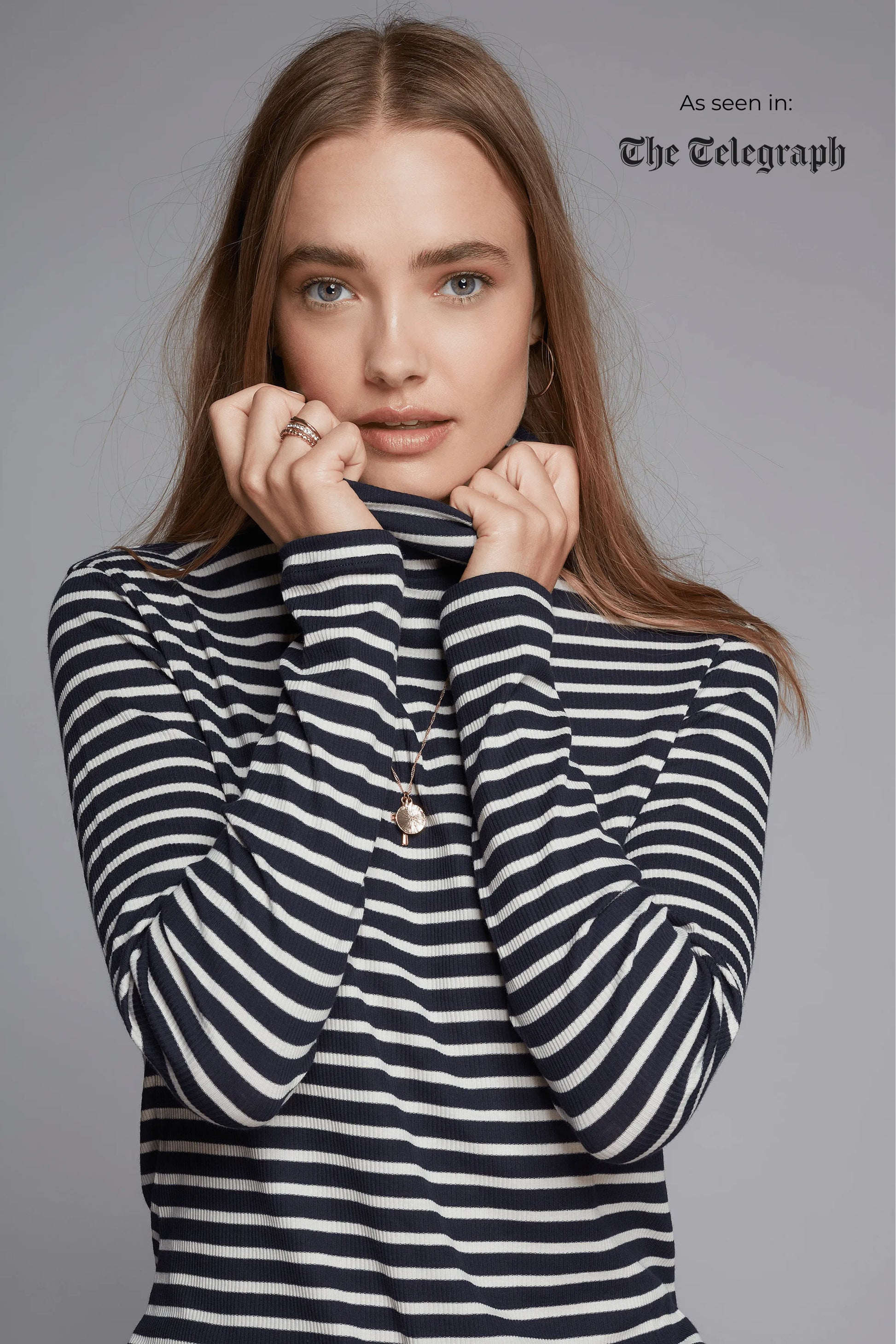 Model wearing the Women's Striped Long Sleeve Cotton Roll Neck Top, styled effortlessly for a chic and polished appearance.