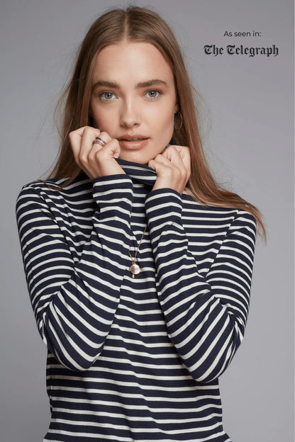 Model wearing the Women's Striped Long Sleeve Cotton Roll Neck Top, styled effortlessly for a chic and polished appearance.