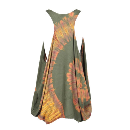 Model wearing the tie dye balloon mini tunic dress styled effortlessly over jeans, demonstrating its versatility and chic appeal for various occasions.