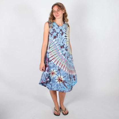 Elegantly styled vibrant tie dye midi dress paired with sandals, ideal for summer outings and fashion-forward looks.