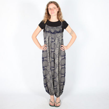 Stylish display of the black mandala print jumpsuit showcasing the unique tie-back detail and relaxed fit for ultimate comfort.
