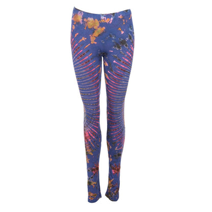 Luxurious vibrant tie-dye stretch yoga leggings in a serene outdoor setting, perfect for festivals and stylish layering.