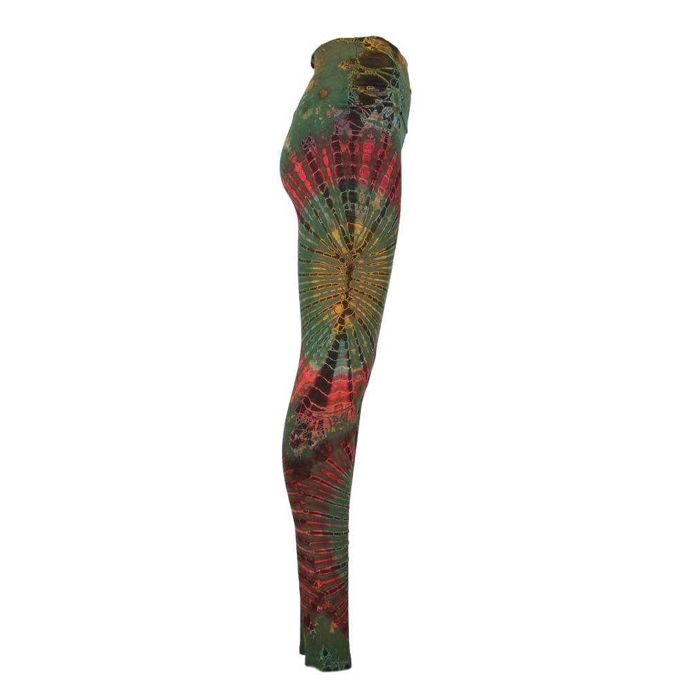 Model wearing vibrant high waisted tie dye leggings styled with a flowing top, demonstrating versatility and comfort in both casual and chic settings.