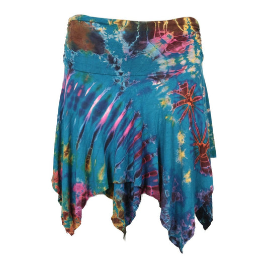Elegant unique tie dye hanky hem mini skirt with ruching detail in vibrant jewel tones, styled for a luxurious summer look.