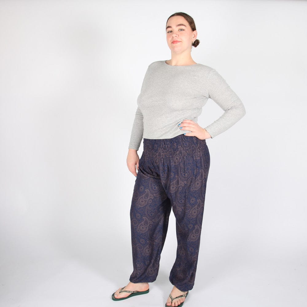 Luxurious geometric paisley harem pants in vibrant hues of coppery brown and golden green, featuring an elegant elasticated waistband and stylish cuffed ankles, perfect for UK sizes 8-16.