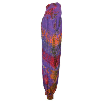 Close-up of unique tie dye patterns on stylish harem pants, showcasing the luxurious fabric blend of spandex and rayon.