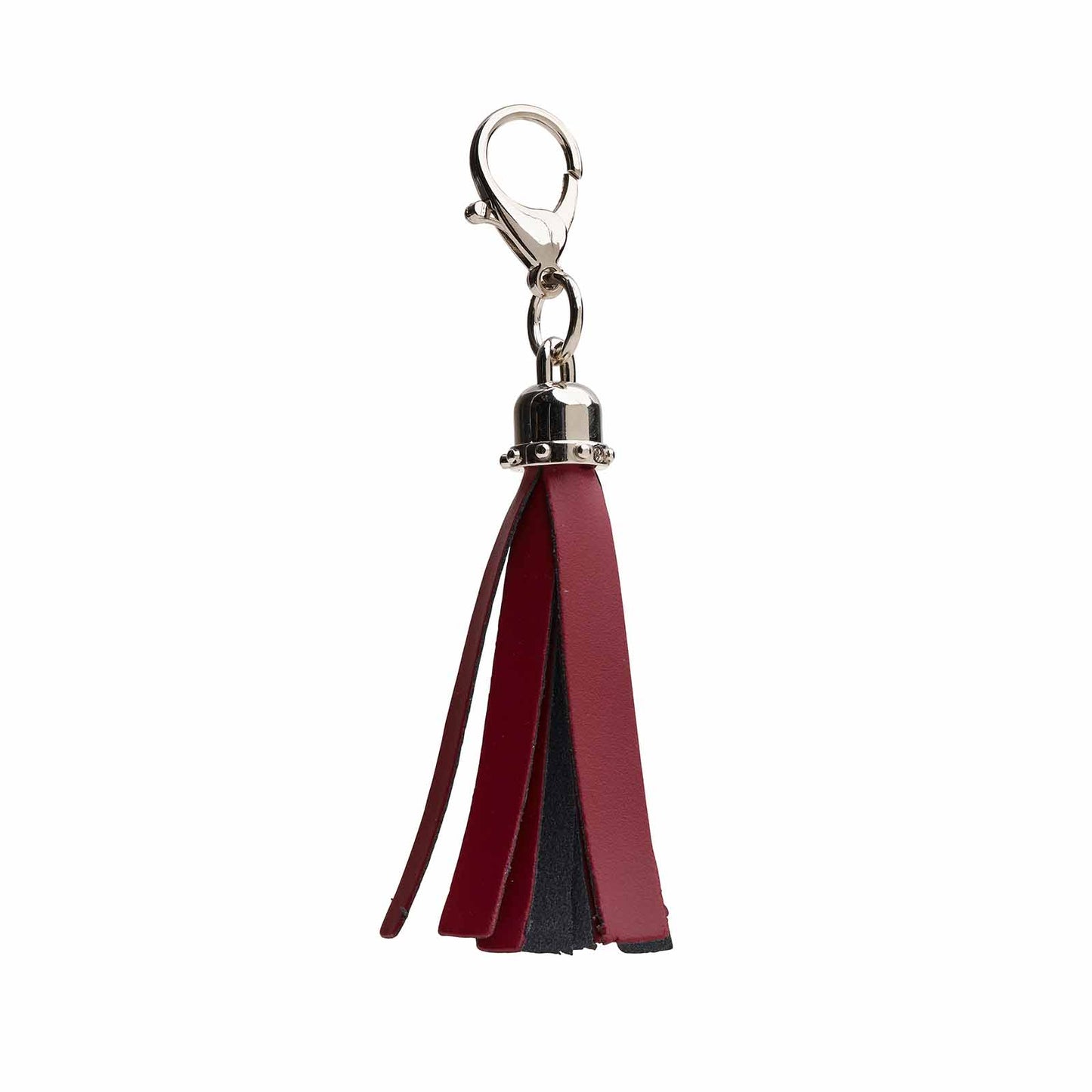 Exquisite handcrafted oxblood mini tassel bag charm by Zatchels, showcasing luxurious leather craftsmanship and chic design for haute couture accessories.